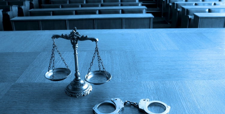Law Scale and Handcuffs - Custodial Sexual Misconduct Definition - Wasatch Defense Lawyers
