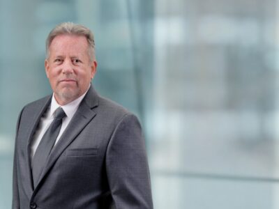 Confident defense attorney outside Salt Lake City courthouse representing due process rights